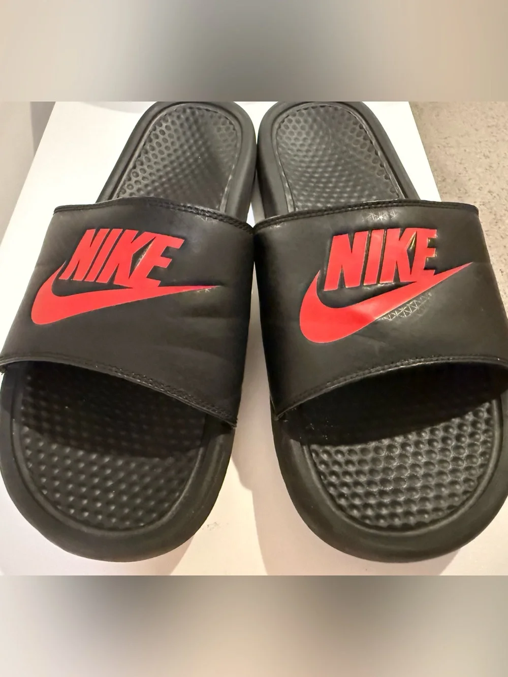 Nike Black Slide Sandals with Red Logo Accent